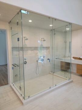 A new bathroom shower built with frameless glass, installed by Great Lakes Glass in Cleveland, Ohio