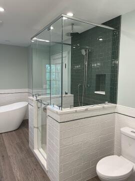 Another view of the custom glass shower enclosure, installed by Great Lakes Glass in Cleveland, Ohio