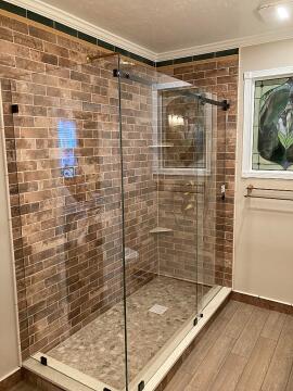 A new custom frameless glass shower enclosure, installed by Great Lakes Glass in Cleveland, Ohio