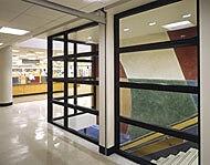 Black framed glass walls for commercial stairwell by Great Lakes Glass