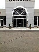 Arched glass entry for commercial building by Great Lakes Glass