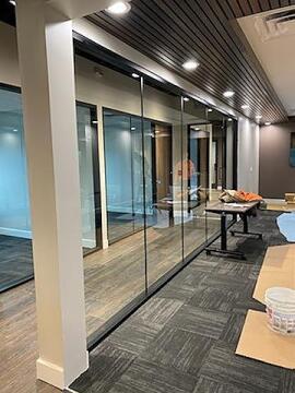 Glass partition wall for office meeting area by Great Lakes Glass