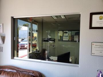 Sliding pass through glass windows for office, installed by Great Lakes Glass in Cleveland, Ohio