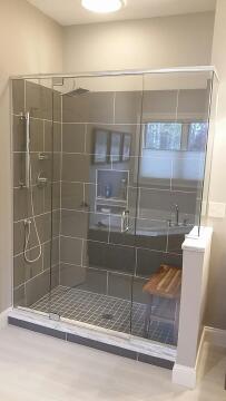 Glass shower enclosure with custom swing glass shower doors, installed by Great Lakes Glass in Cleveland, Ohio