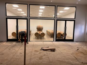 Great Lakes Glass glass specialist installing custom glass doors for wine room
