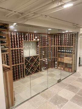 Custom frameless glass enclosure for for wine room, installed by Great Lakes Glass in Cleveland, Ohio